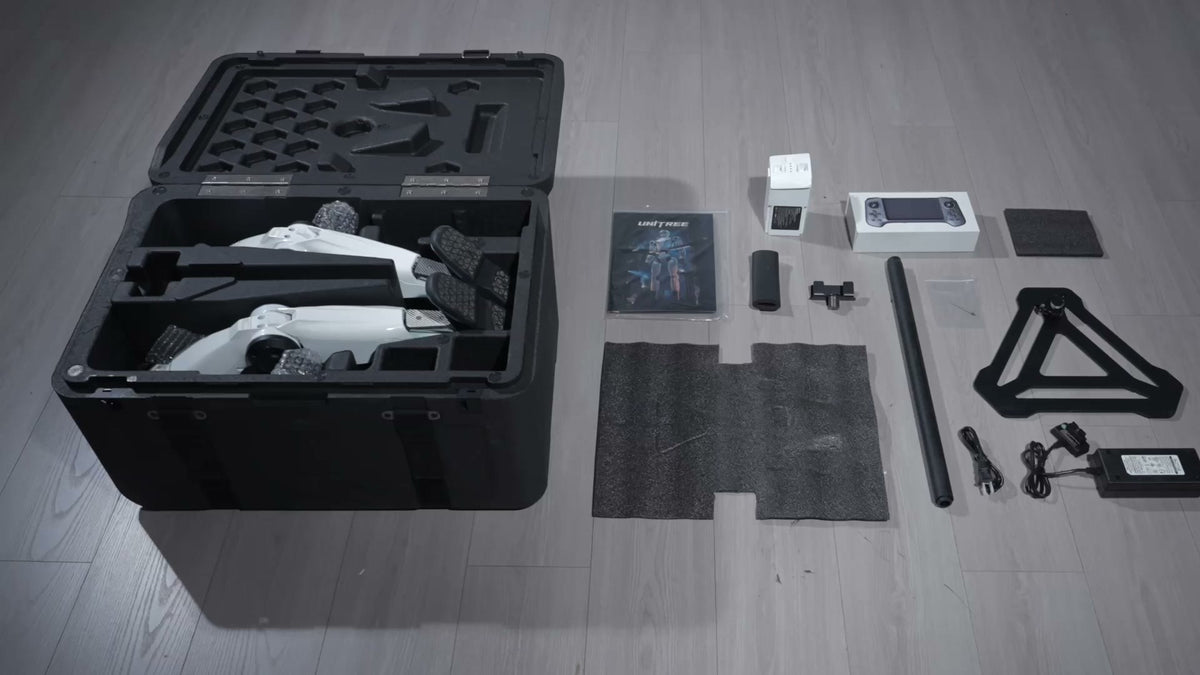 Unitree R1 in its transport case with battery, charger, remote and stand